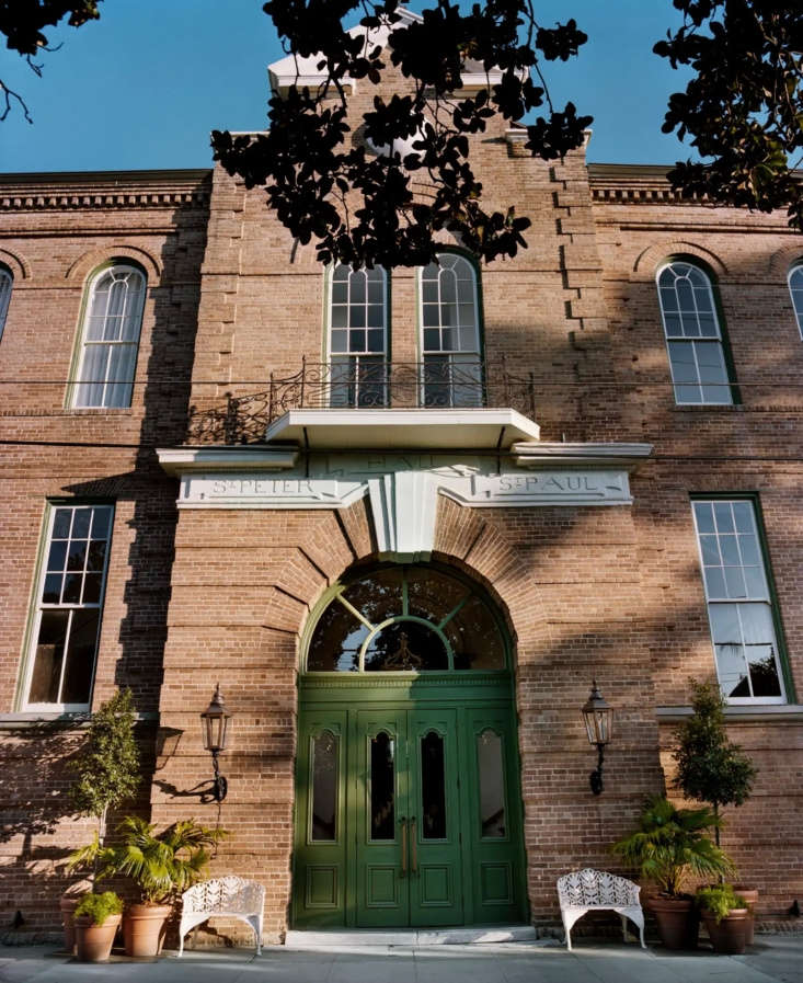 The red brick facade of the Hotel Peter & Paul schoolhouse.