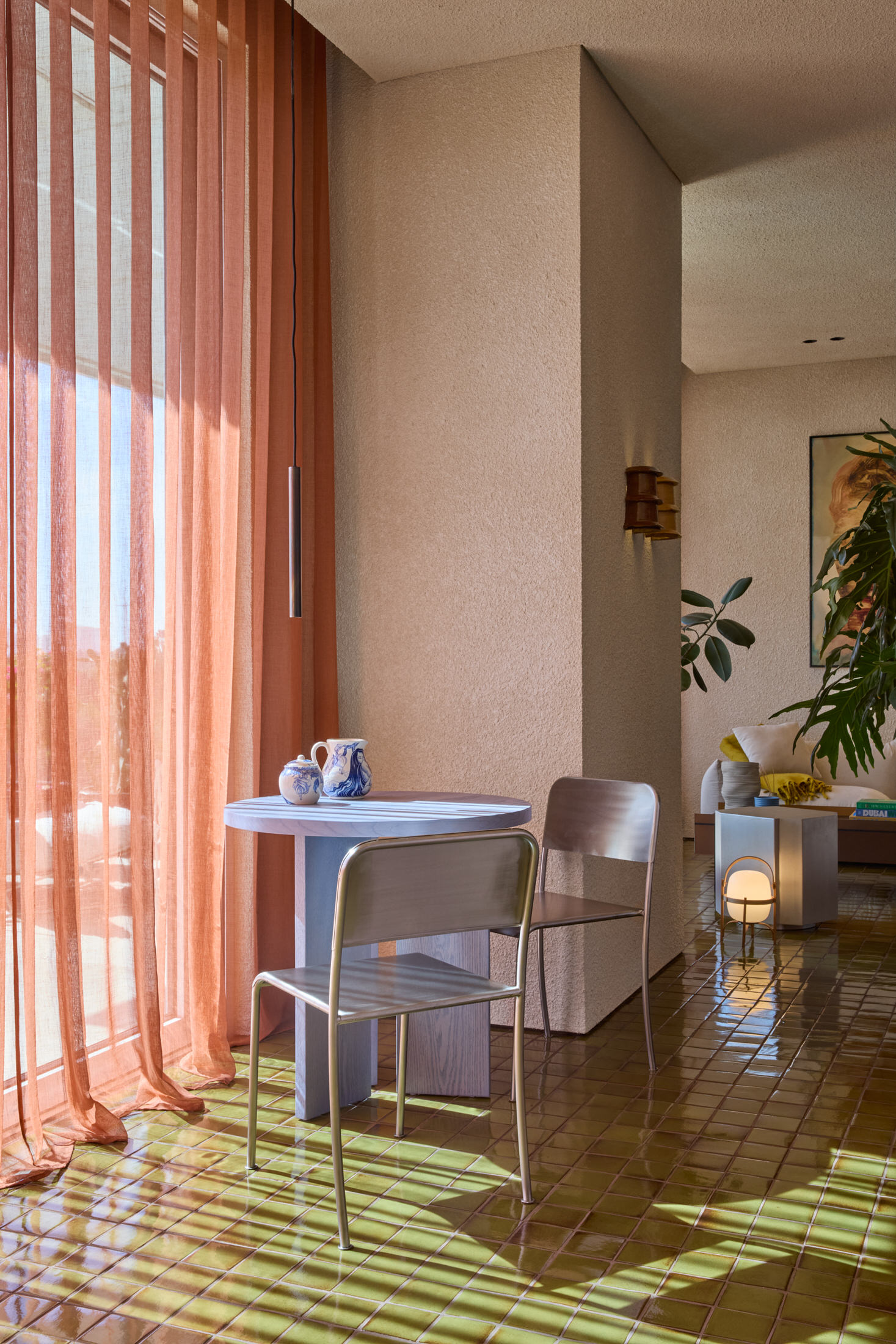 Central wooden cabinetry unit acting as a partition between living zones.