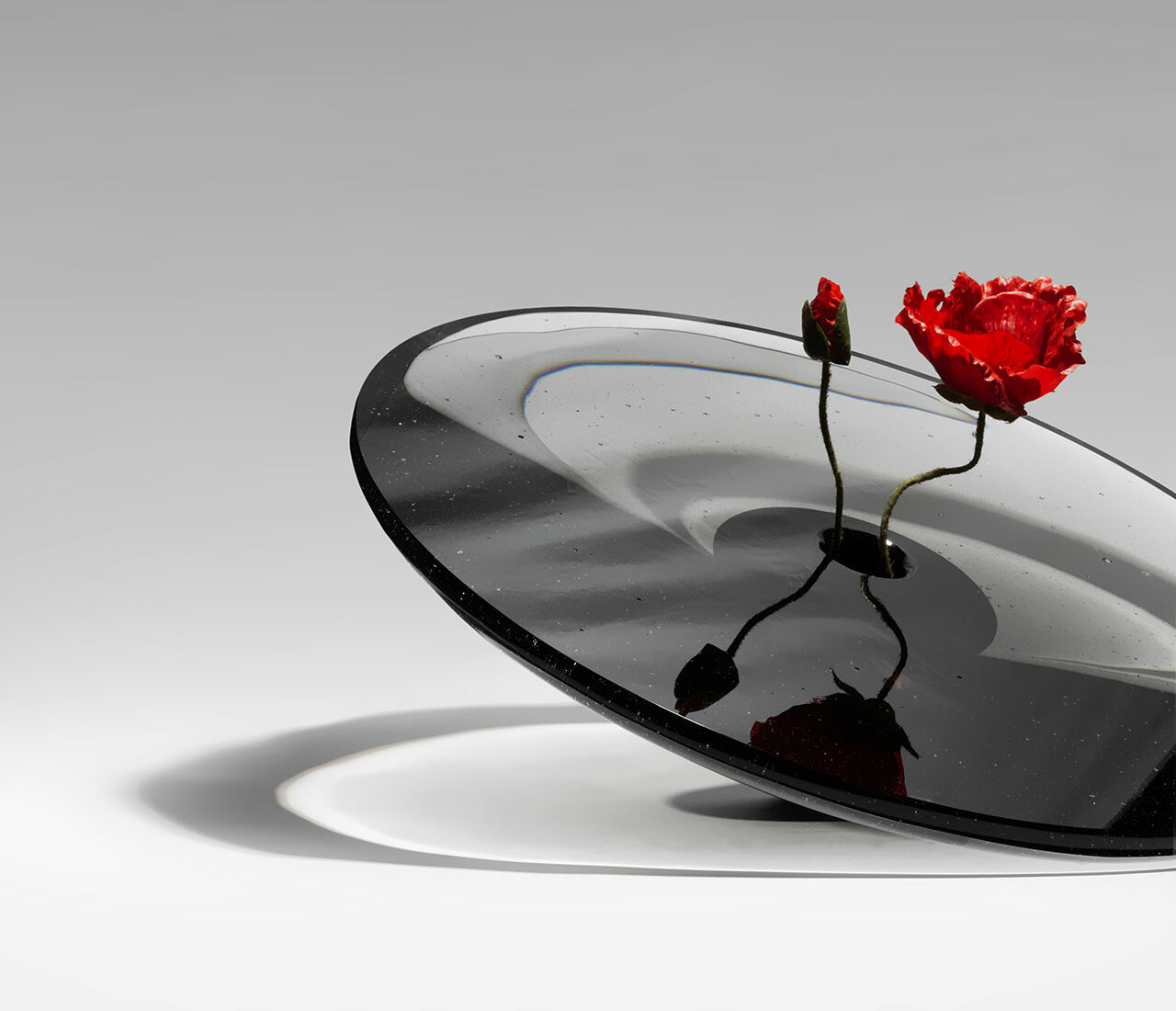 A close-up of the Black Hole Vase featuring its unique smoky conical form.