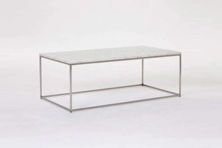 Rectangular coffee table with a white marble top and a thin bronze metal frame.
