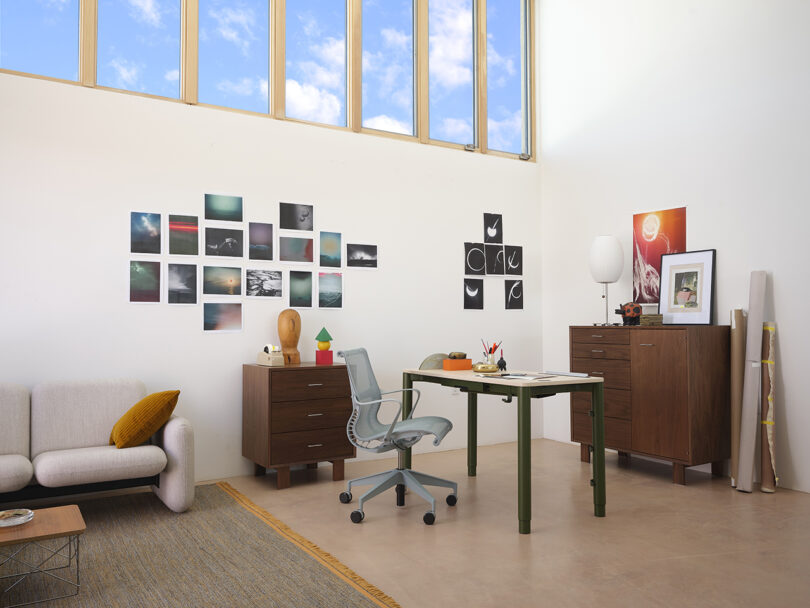 Modern home office featuring a green Herman Miller Spout desk, ergonomic chair, and natural light.