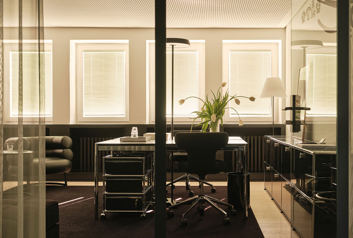 Bright, open-plan office space featuring sleek furniture and clean architectural lines.