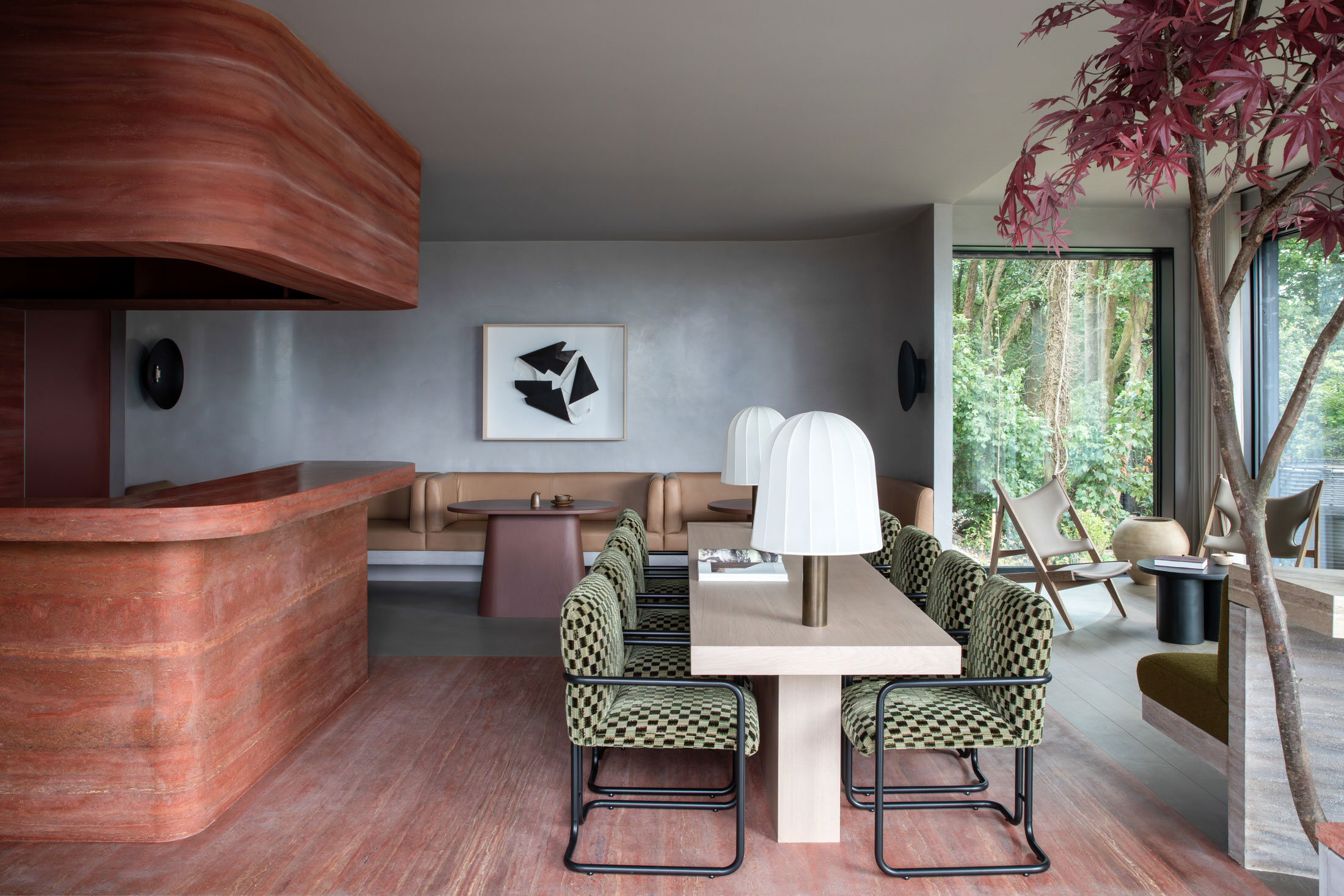 The interior of the Clubhouse with red velvet seating and refined timber joinery.