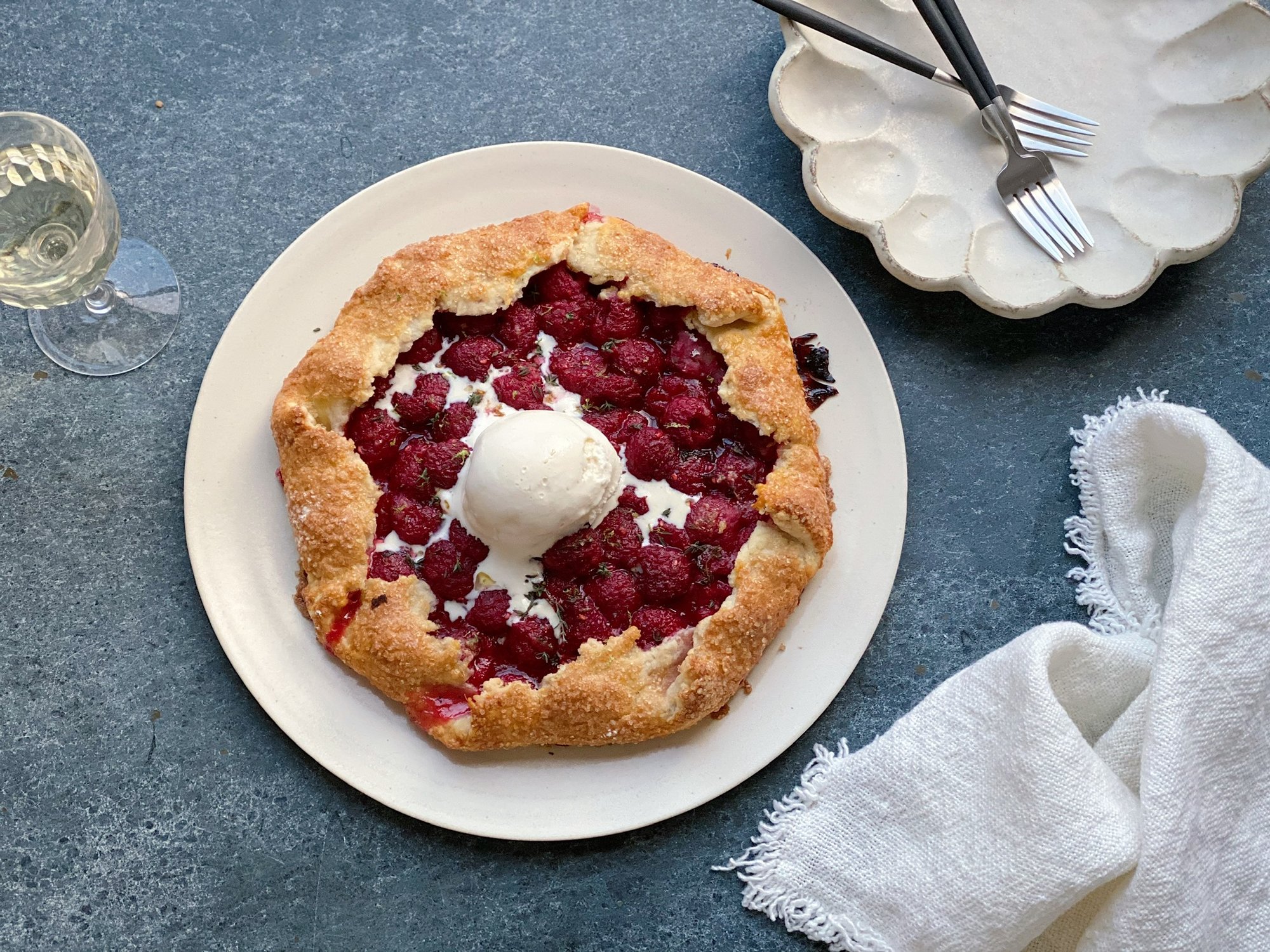 A variety of fruit-based summer desserts including tarts and grilled fruits.