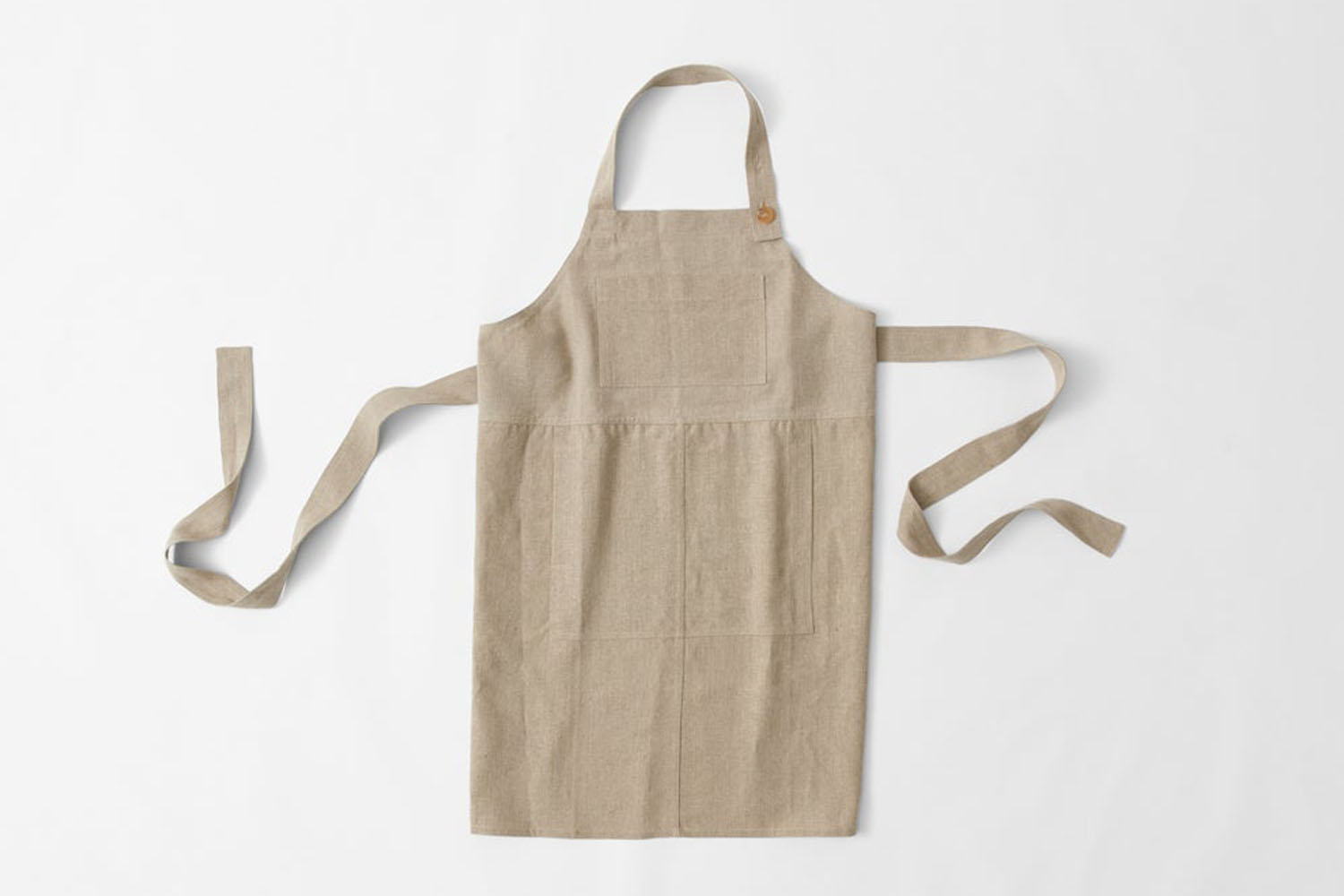 A sturdy, dark-toned heavy-duty utility apron with reinforced stitching.