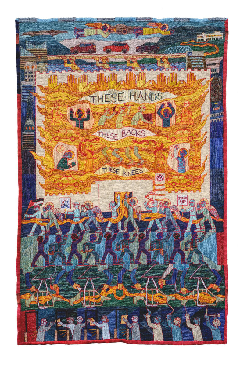 A colorful tapestry featuring silhouettes of people and hands with the text 'These hands, these backs, these knees.'