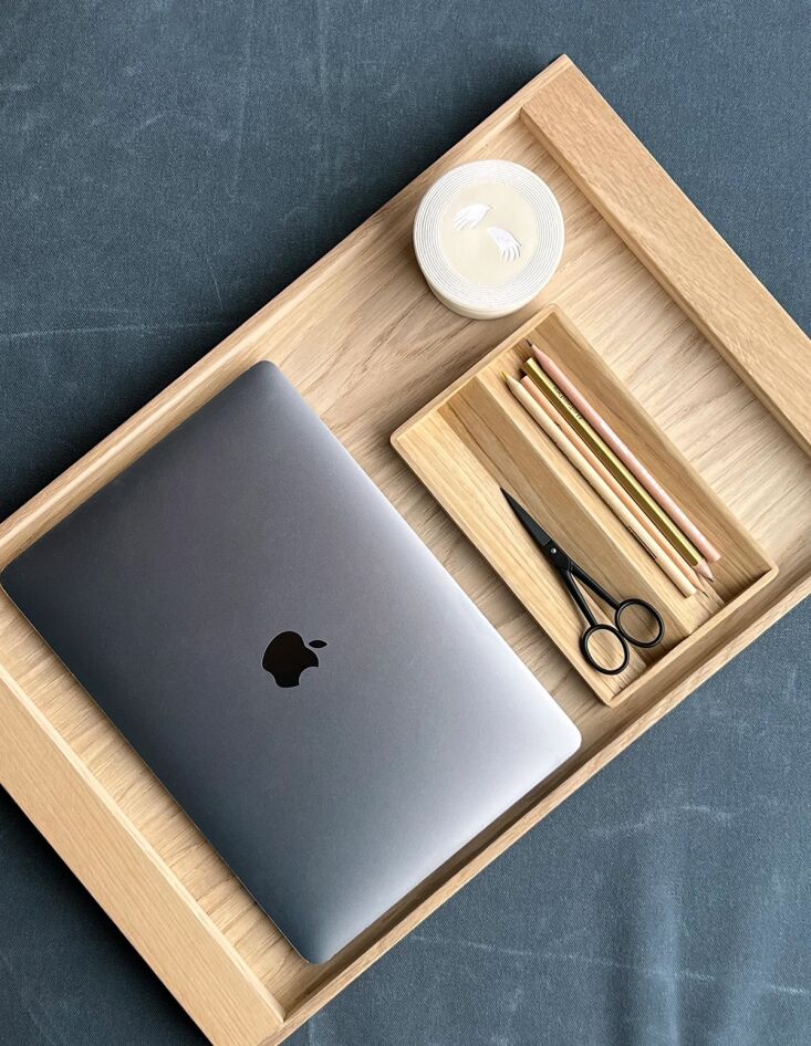 Oiled oak nesting trays containing Japanese scissors and small office supplies.