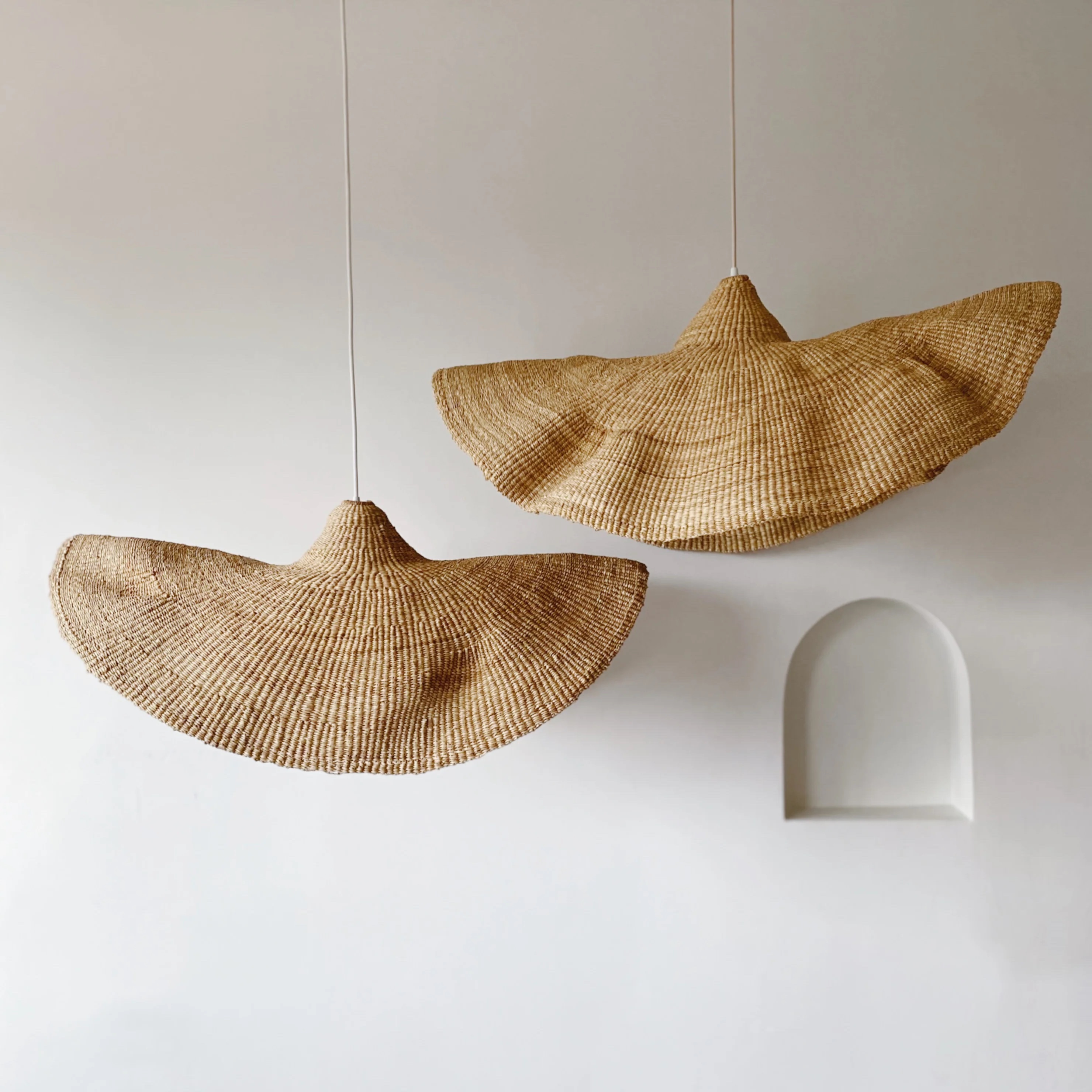 The Fawn Pendant handwoven from elephant grass by Ghanaian artists.