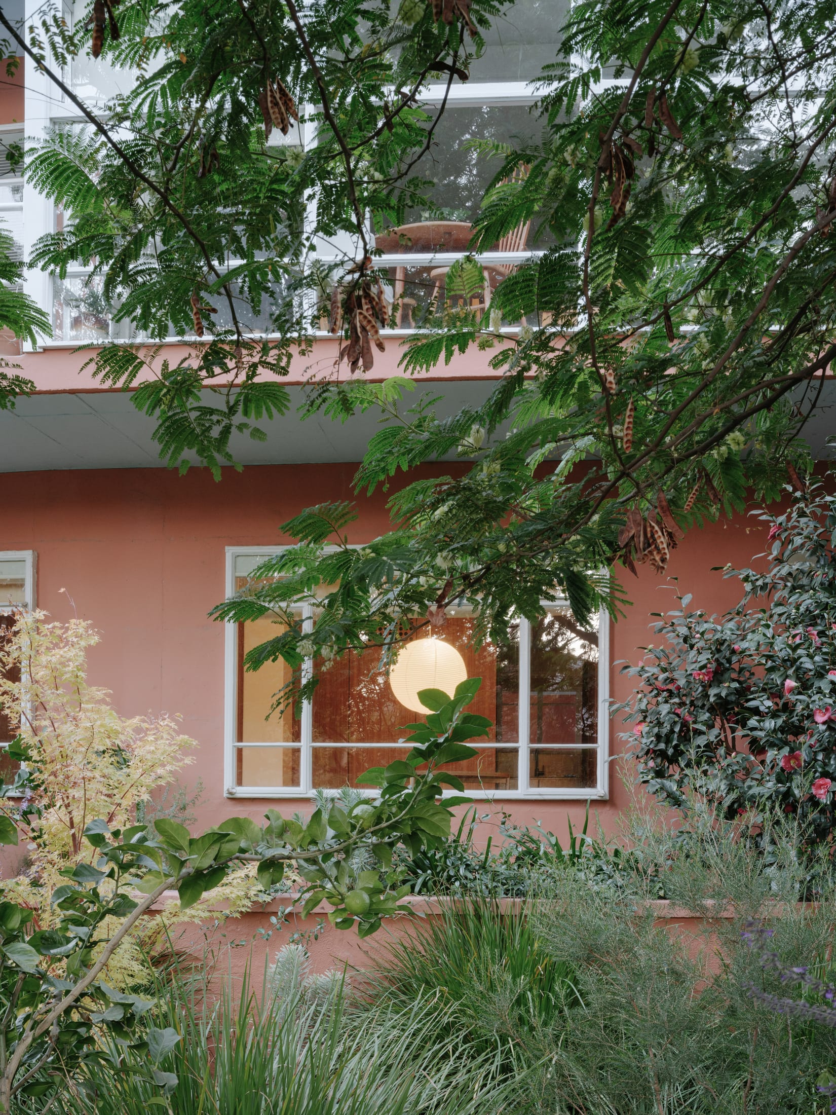 Minimalist staging in a small apartment bedroom with clean lines and functional furniture.
