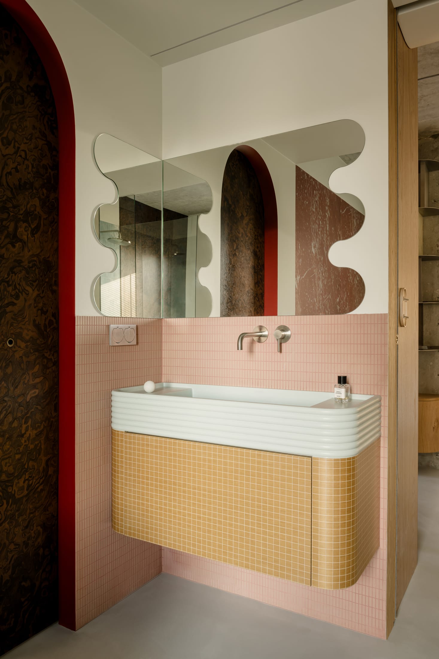 Bedroom with dark oak wood paneling and custom built-in storage.