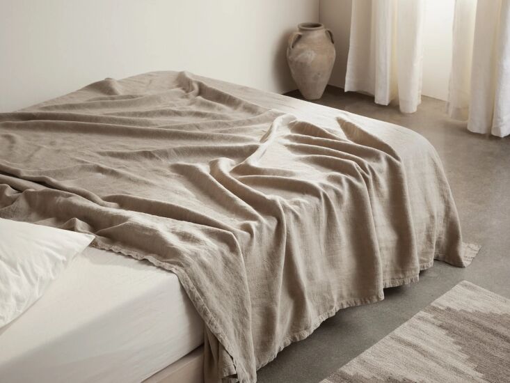 A natural-toned Vintage Linen Bed Blanket from Parachute with a soft, lived-in texture.