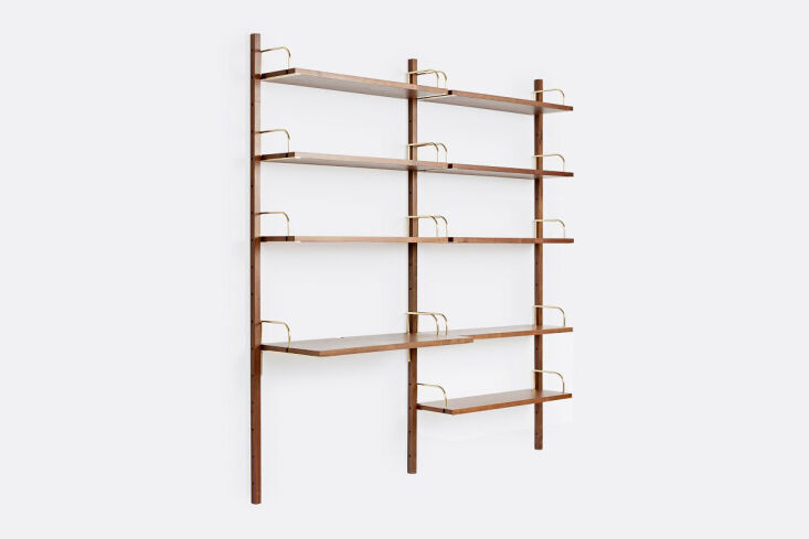 Hart Modular Walnut shelving system featuring a double-bay setup with a built-in wooden desk.