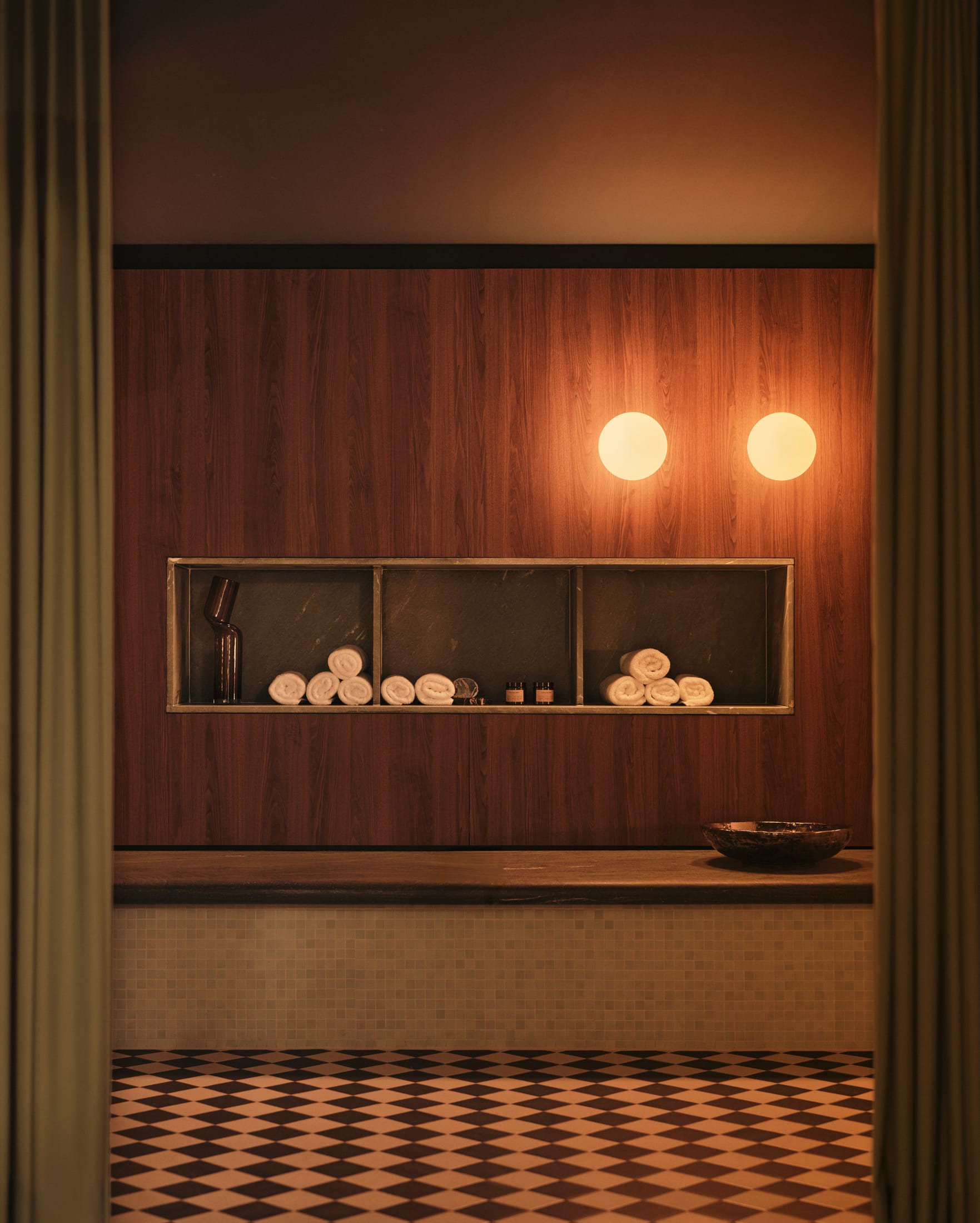 Close-up of iconic designer furniture including a USM Haller desk and curated seating.