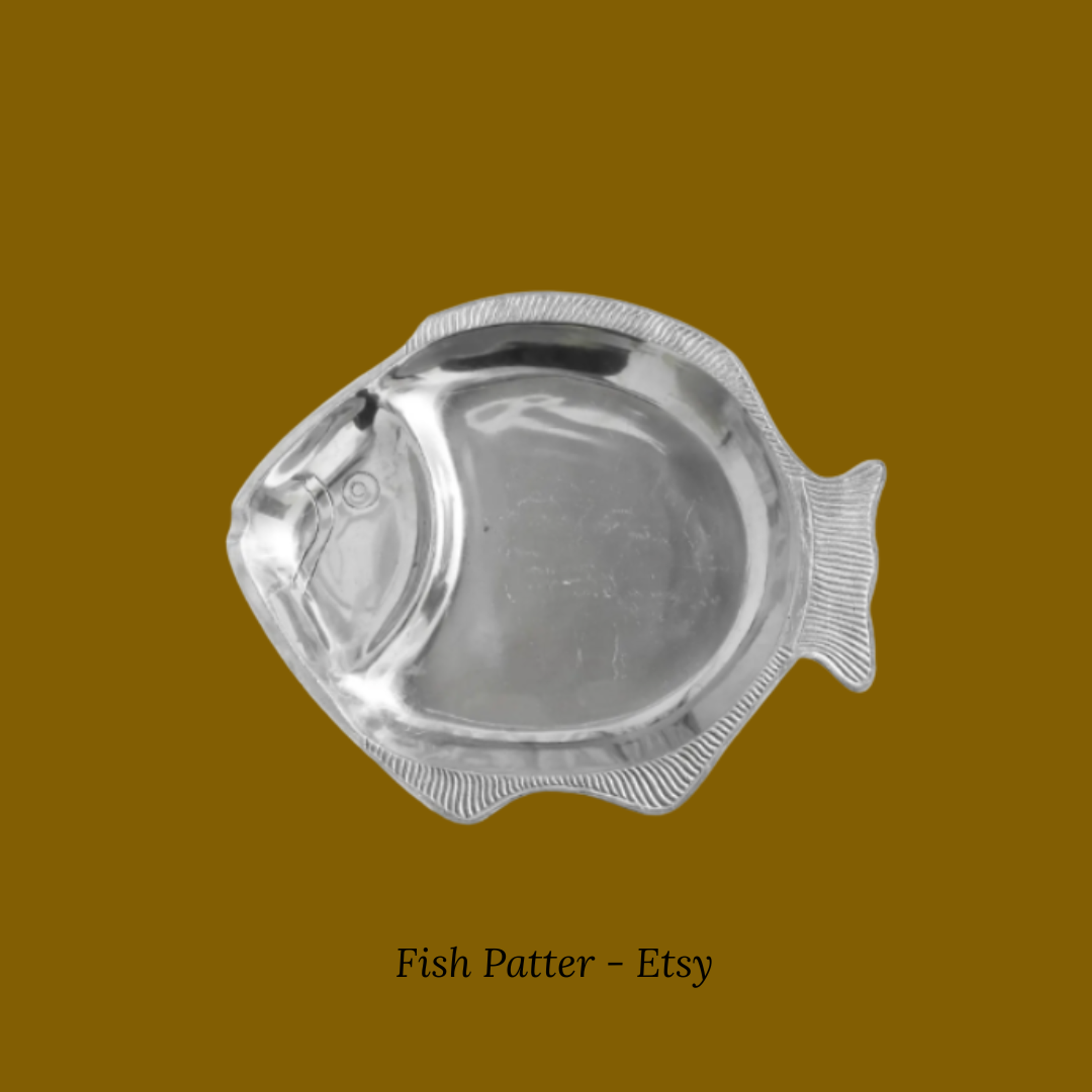 A sculptural ceramic fish-shaped serving platter.