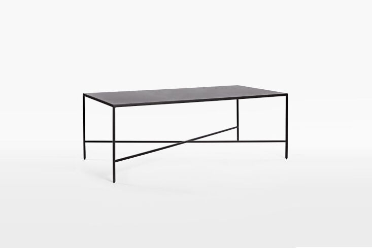 Industrial-style solid iron coffee table with visible weld details.