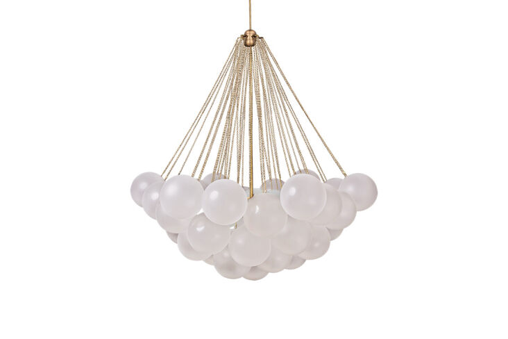 Close-up of the Apparatus Cloud Chandelier featuring mouthblown frosted glass orbs and intricate brass chain detailing.
