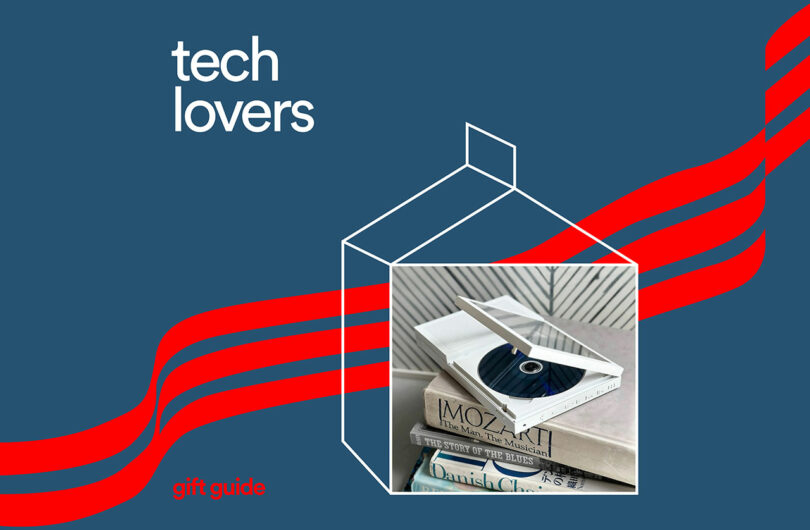 A CD player on books with 'Tech Lovers' text on a blue background.