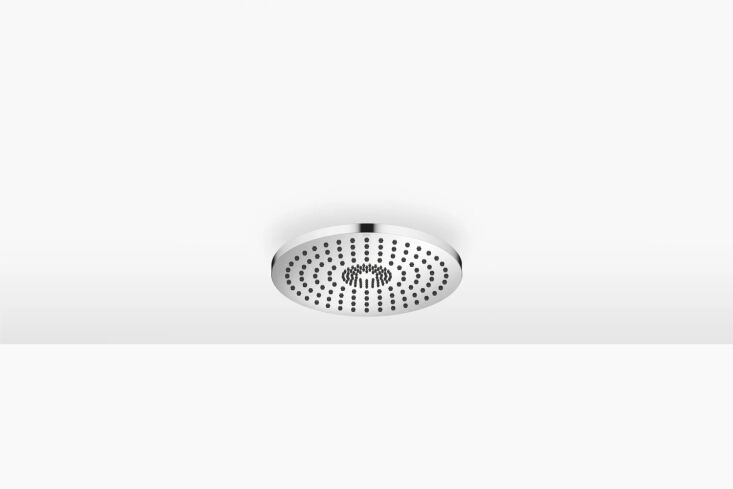 Close-up of a circular chrome rain shower head recessed into a white ceiling.