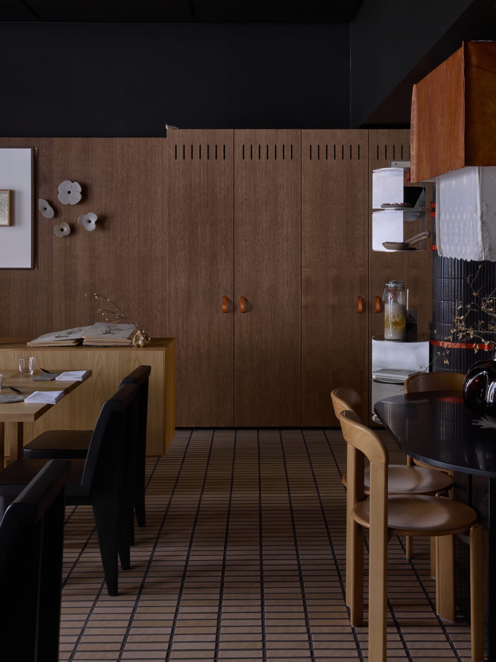 Wide shot of Boreal Restaurant interior showing the entrance and timber wall panels.