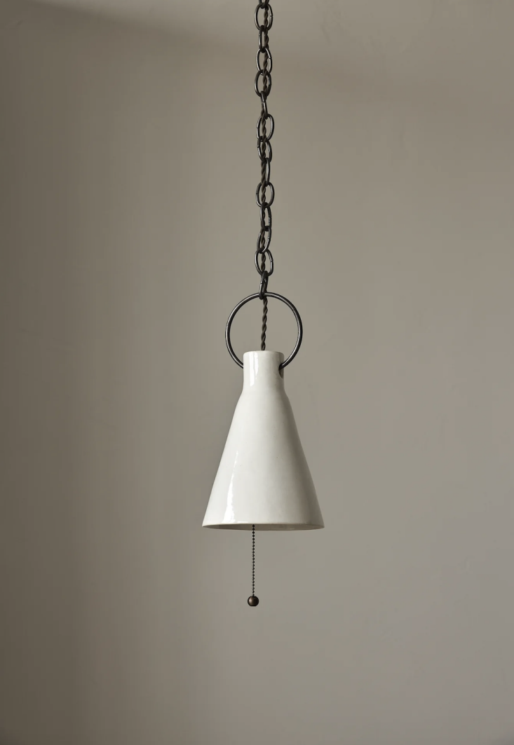 A single Salt white gloss ceramic funnel pendant light showing its reflective surface.