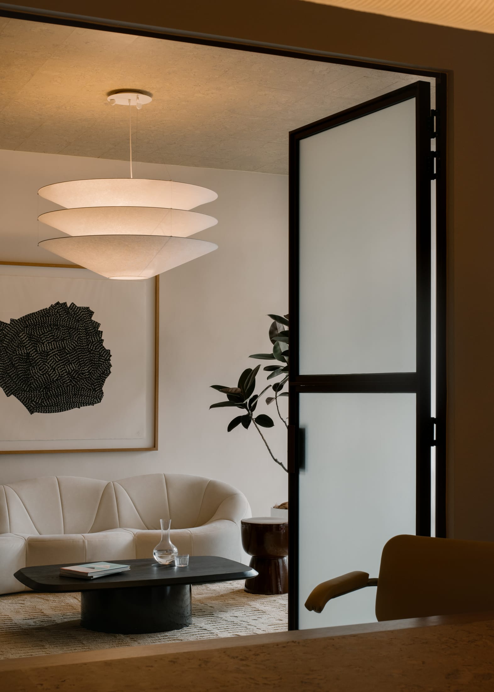 A creative zone featuring mood boards and a photo studio setup within the office.