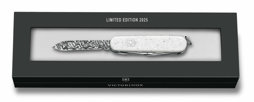 The 2025 Limited Edition Victorinox knife displayed in its official black presentation box with a certificate window.