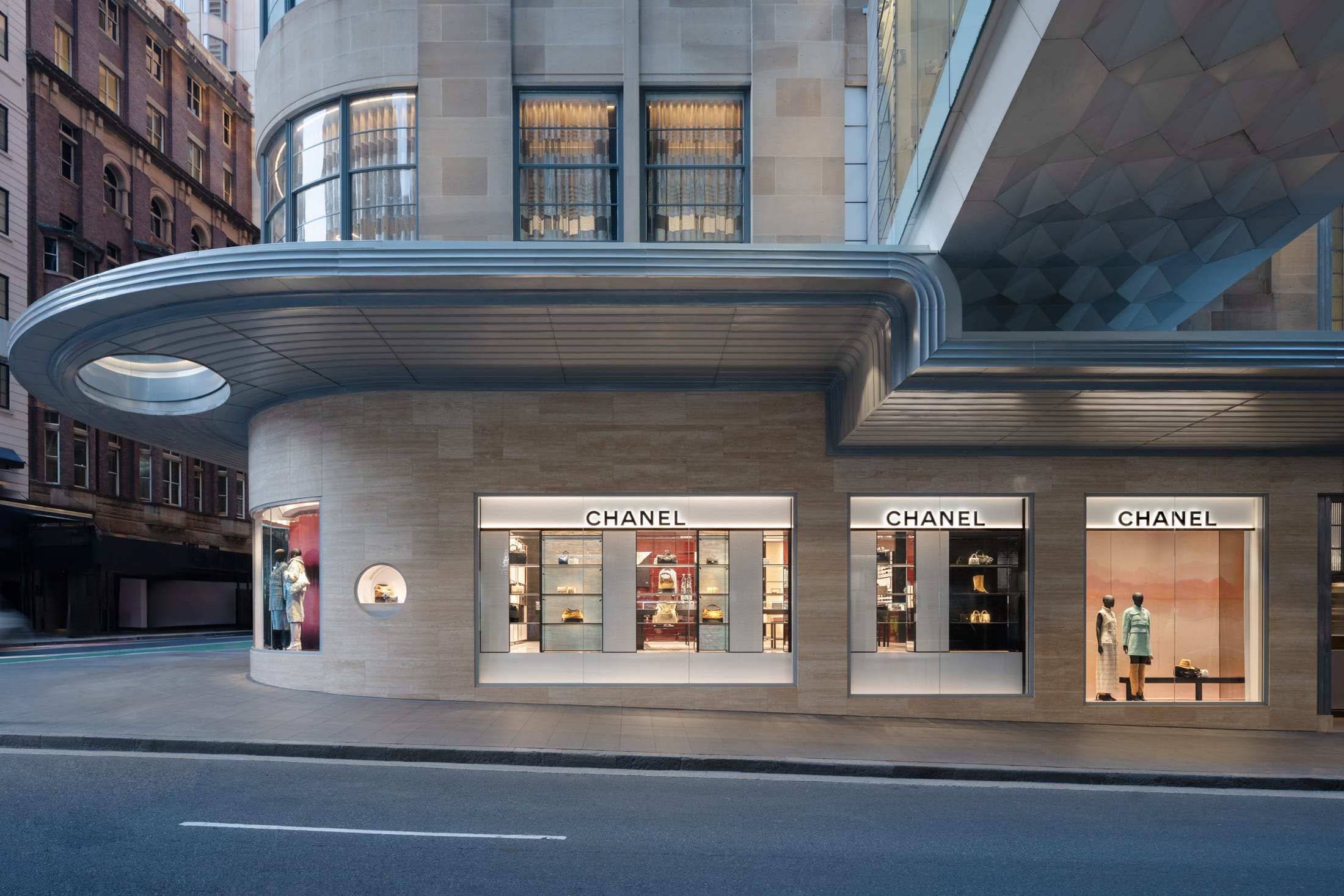 A wide interior view of the Chanel Sydney boutique showing the open-plan layout and elegant displays.