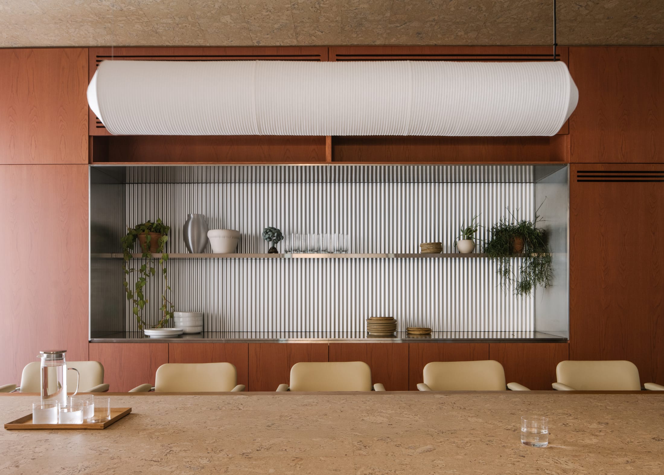Vertical shot of the Brutalist concrete structure emphasizing the geometric vaults and natural light.