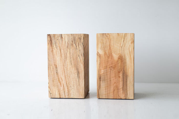 A solid wood chunky side table or nightstand with visible grain.
