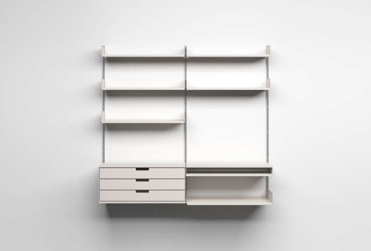 Vitsoe 606 Universal Shelving System featuring aluminum E-tracks, drawers, and an integrated desk.