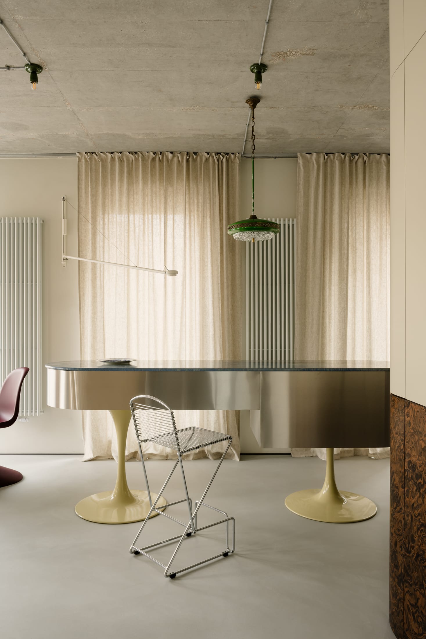 Light-filled living room with contemporary furniture and industrial architectural details.